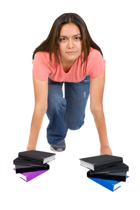 girl in racing position with books in front of her hands over white