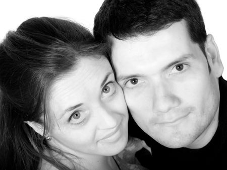 close up of a couple with faces together over white in black and white