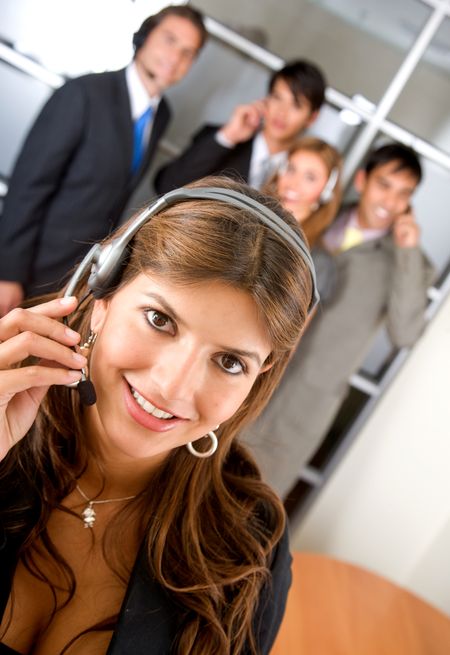 business customer service woman smiling with her team behind