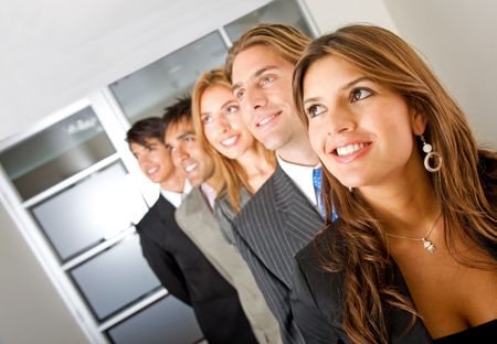 business woman and her team looking away in an office