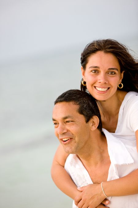 happy couple at the beach during vacation