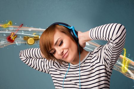 Pretty young woman listening to music, instruments concept