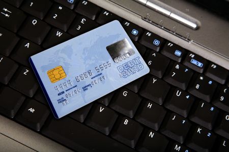 credit card over a computer keyboard - note the design of the card is my own