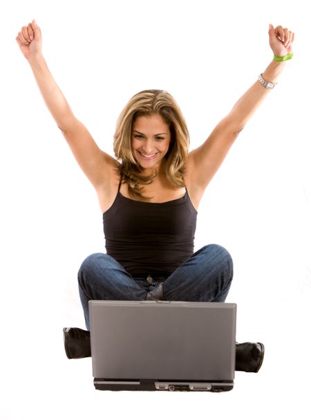 casual woman on a laptop computer having online success- isolated over a white background