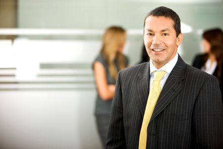 senior business man smiling in an office