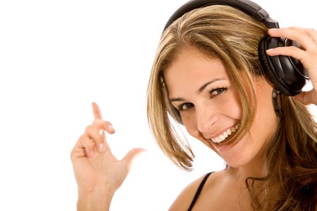 woman listening to music on her headphones looking happy - isolated over a white background