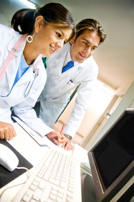 couple of doctors in a hospital on a computer