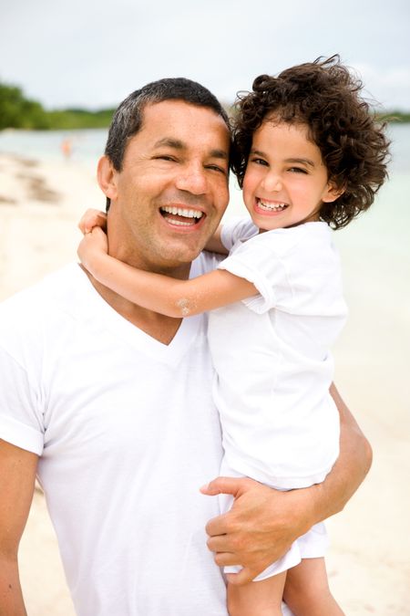 father and son having fun at the beach