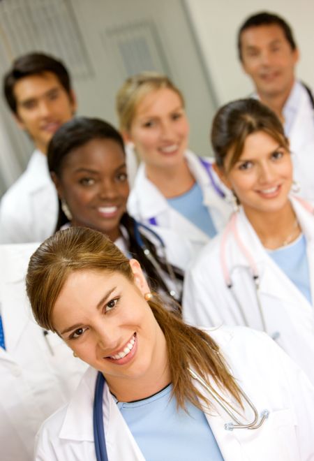 group of doctors in a hospital smiling