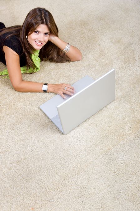 woman with a laptop working from home smiling