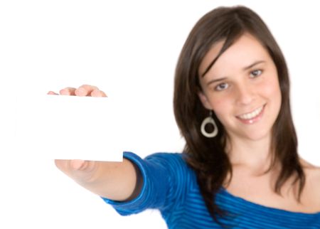 beautiful casual girl holding a business card over a white background - focus is on card so it is good for you to write something on it