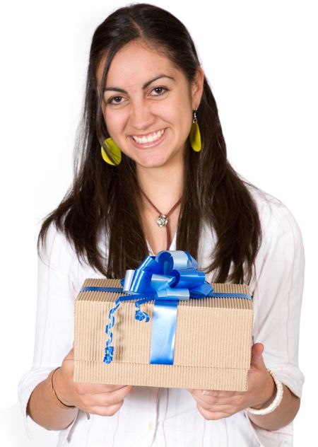 girl happy with her gift over a white background - focus is on the gift