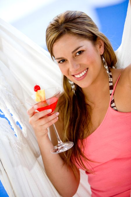woman having a cocktail drink while on vacation