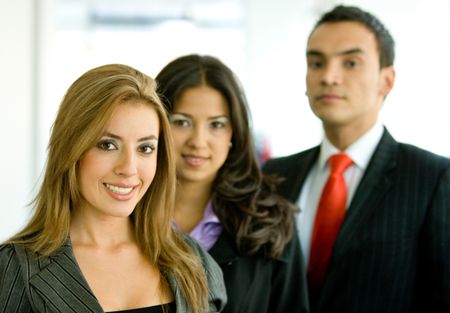 business people in an office smiling - small team