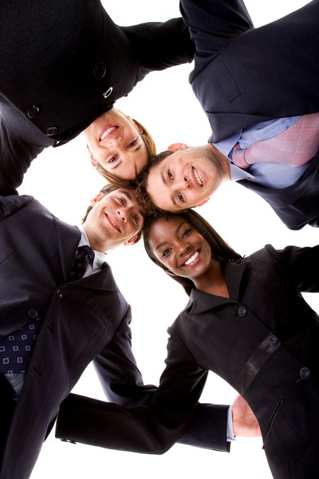 business people teamwork in an office with heads together - isolated