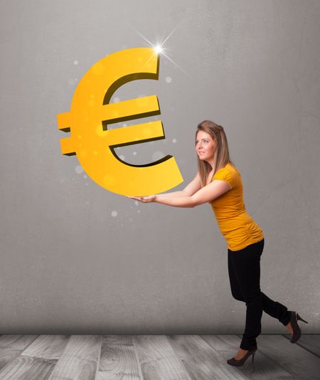 Beautiful young girl holding a big 3d gold euro sign