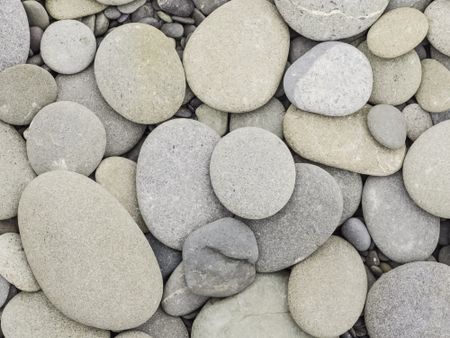 Variety of stones, smoothed by waves, on beach along Pacific coast of Olympic Peninsula in Washington