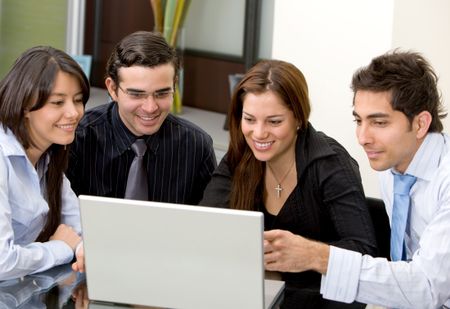 business team in a meeting on a laptop computer in an office
