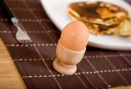 breakfast in bed series - focus is on egg