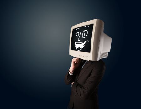 Happy businessman with a personal computer monitor head and a smiley face