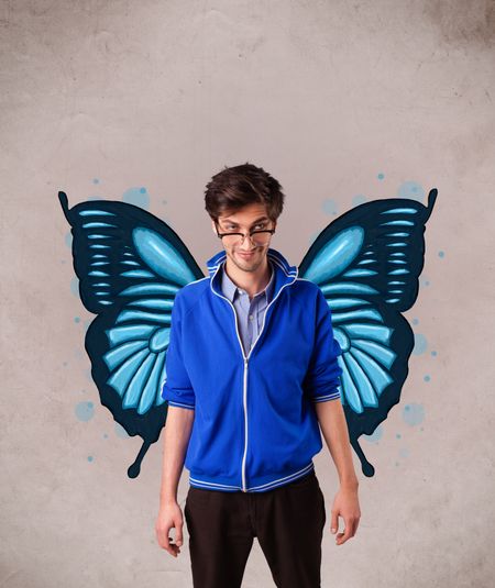 Handsome young man girl with butterfly blue illustration on the back