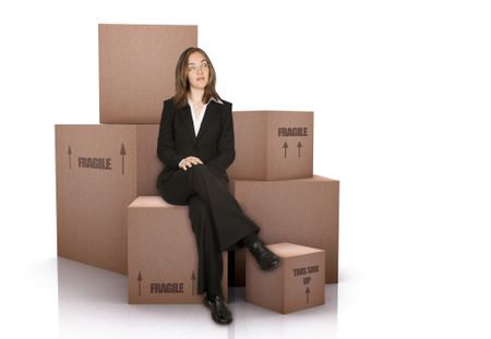 business woman with packed cardboard boxes over a white background