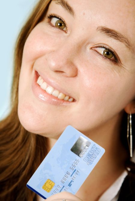 business woman with credit card over a cyan background - note the credit card numbers are made up and the design is my own