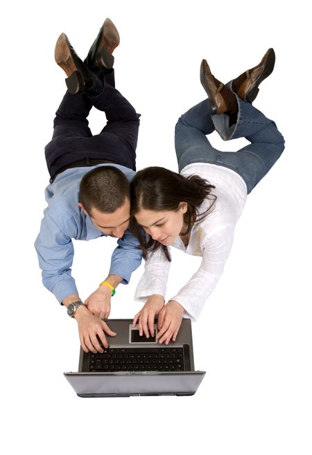 couple on a laptop on the floor over a white background