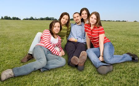 friends on the floor in a park on a sunny day