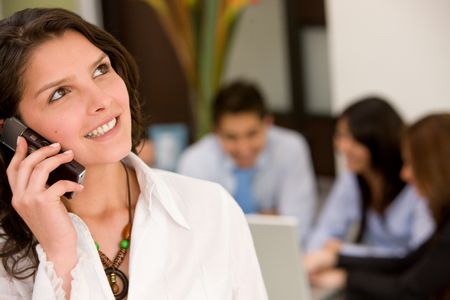 business woman talking on the phone in an office