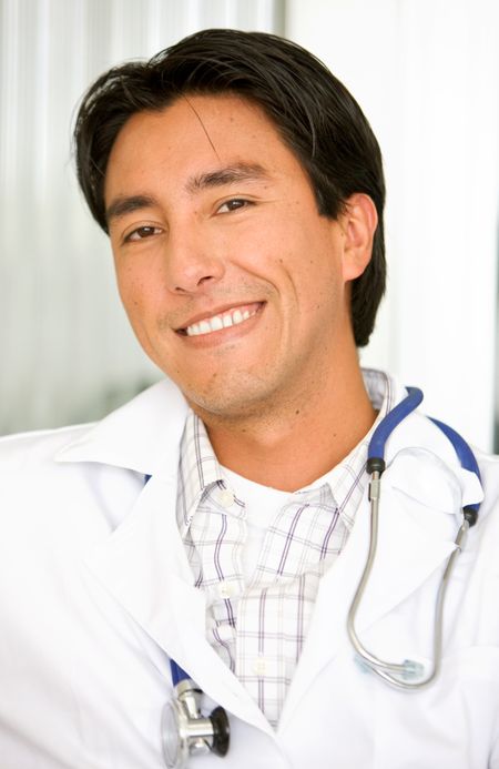 male doctor smiling in a hospital - latin american