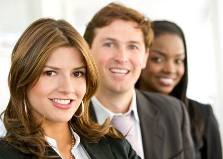 business team smiling in an office - diversity