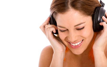 Woman listening to music isolated over a white background