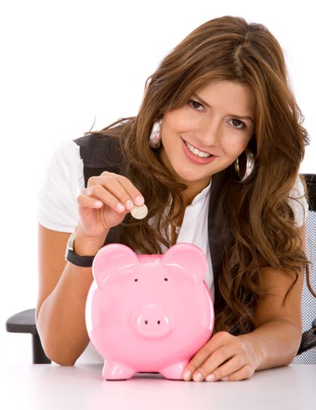 business woman looking at her savings in a piggy bank
