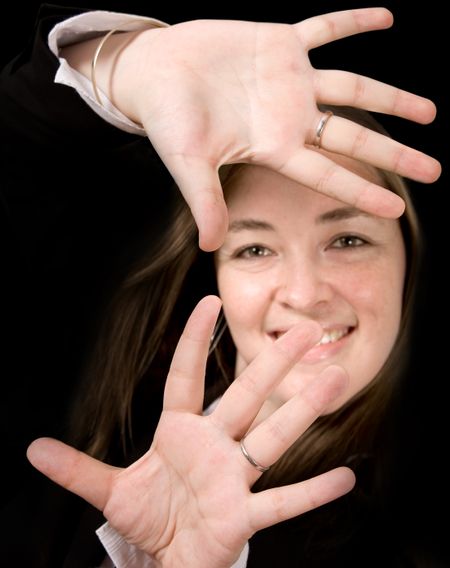 Business Woman with hands on screen over a black background