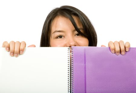 beautiful student looking over notebook ove a white background