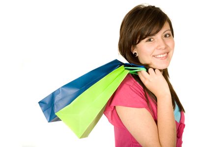 beautiful teenager with shopping bags over white