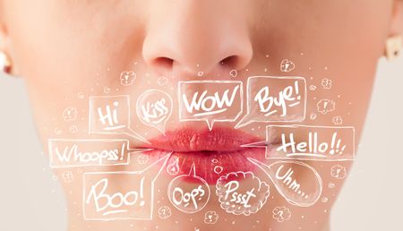 Beautiful red lips with white speech bubbles close up