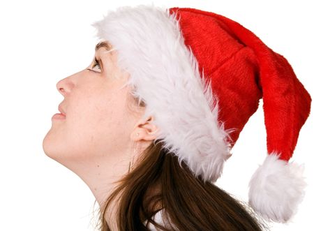 beautiful girl wearing a christmas hat looking up over white