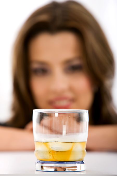 woman having  glass of whiskey isolated over white