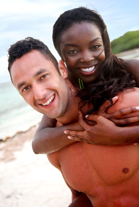 happy beach couple smiling and having fun - diversity