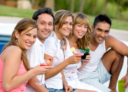 Happy group of friends smiling on their summer holidays