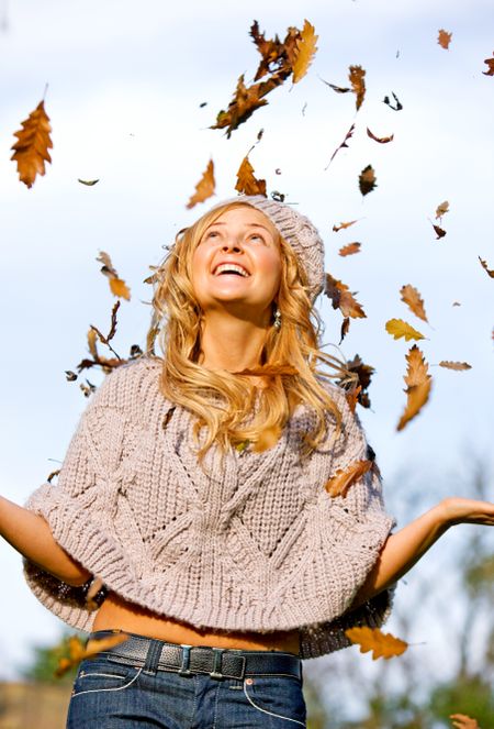 autumn woman smiling and having fun outdoors
