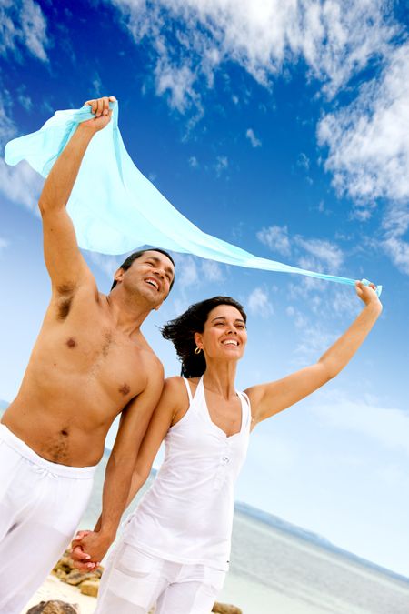 happy couple at the beach on vacation