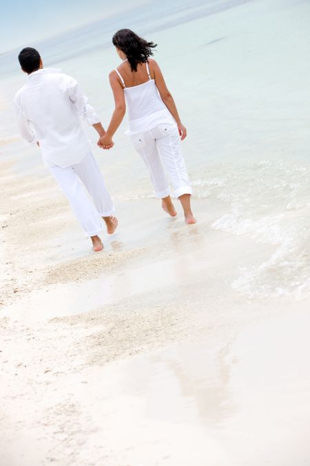 couple in love walking along the beach