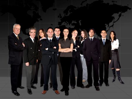 business team in front of a worldmap in the background