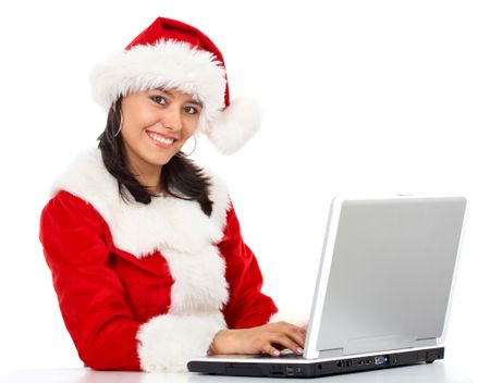 christmas woman working on a laptop - isolated over a white background