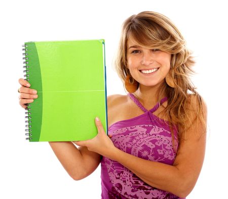casual female student smiling and holding a notebook - isolated over a white background