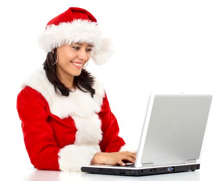 christmas woman working on a laptop - isolated over a white background