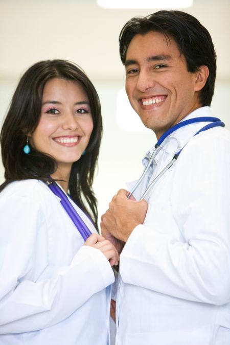doctors in a hospital smiling and looking friendly